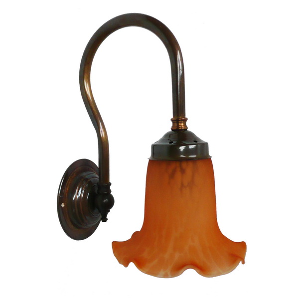 "Manufactured in Ireland, this quality brass wall light comes complete with amber bell glass shade."