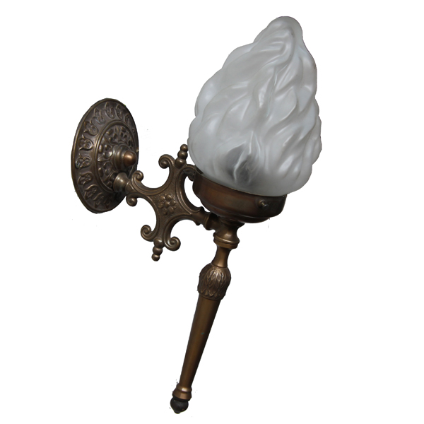 "Manufactured in Ireland, this quality brass wall light comes with frosted flame glass shade."