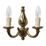 "Manufactured in Ireland, this quality solid brass double arm wall light looks perfect in any traditional style setting."