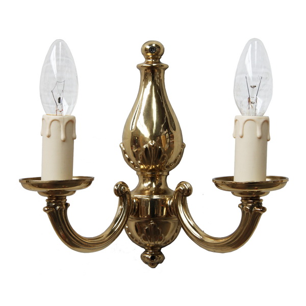 "Manufactured in Ireland, this quality solid brass double arm wall light looks perfect in any traditional style setting."