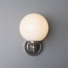 "Add a modern look to your home decor with the Cloghan Modern Globe Wall Light."
