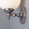 "Add a modern look to your home decor with the Cloghan Modern Globe Wall Light."