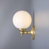 "Add a modern look to your home decor with the Cloghan Modern Globe Wall Light."