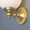 "Add a modern look to your home decor with the Cloghan Modern Globe Wall Light."