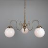 "Manufactured in Ireland, this quality brass chandelier comes complete with 200mm opal glass shades and is perfect for any traditional or brasserie style setting."