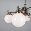 "Manufactured in Ireland, this quality brass traditional globe chandelier comes complete with 250mm opal globes."