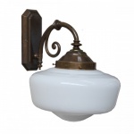 "Manufactured in Ireland, this solid brass 1920s inspired traditional wall light comes with schoolhouse glass shade."