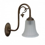 "Manufactured in Ireland, this traditional brass wall light comes complete with ridged bell glass shade."