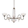 "The Padang chandelier is an ornate, traditional chandelier with three ornate, swirling brass arms supporting Holophane glass lamp shades."