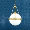 "The Ardee is a traditional glass globe chandelier. An opal glass globe lamp shade sits on a circular brass ring."