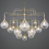 "The four-tier Rome chandelier is an impressive Mid-century design. This show stopping brass chandelier illuminates grand interiors."