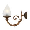 "The Darwin single wall light is an up lit wall light that features a decorative curved arm and a flame glass lamp shade."